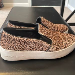 Michael Kors slip on Animal print loafers.